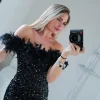 Vestido mini plumas glitter negro